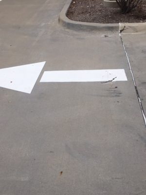 white-directional-arrow-in-parking-lot-austin-tx